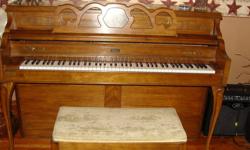 (Conn) upright piano. Pecan wood color. Beautiful piano and cushioined bench just in time to play Christmas music for the holidays. Please call if interested. 315-232-4112. Cash only. No paypal. Leave message if no answer. Thank you.