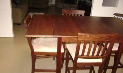 *** Counter Height Table and 4 chairs covered in Beige Microfiber. Table has two pullout sections on it. This set was purchased at Pier One and is in excellant condition. Please call 782 8882 and leave a message if necessary. I will return all calls.*****