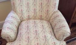 Beautiful, sturdy and very comfortable upholstered swivel arm chair from Crate & Barrel - manufactured by Lee industries Inc. Beige background upholstery with pink and light blue floral design. Very lightly used - from a bedroom in a non-smoking home. The