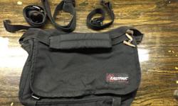 Here is an EastPak black messenger/utility shoulder bag. The bag is in great condition and looks as if it were rarely, if ever used. I have had this bag in the back of my closet and just never use it so am looking for a new home for it. The adjustable
