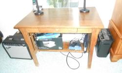 I have for sale a full size computer desk in excellent condition. This desk features a smoked panel cabinet that hides your CPU tower, a hanging filing cabinet, a pull out keyboard tray, drawers, cubbies, and an elevated shelf that works well to hold your