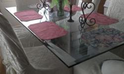 Solid glass dining table, seats six. Excellent condition.