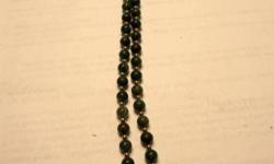 green and gold beads with pendant of yellow-pressed flower-19"
