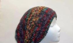 This slouch hat is a multi-color hand knitted hat. Very stretchy, will fit any head, stretches out to 31 inches around. The measurements are lying flat on a table, across the brim or ribbing = 9 Â½ inches, across the widest part 11 inches and the length