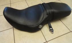 Here is a like NEW Harley Davidson Road King Leather Seat.
It came off an 2005 Road King Classic and was replaced by an after market seat.
The seat shows no sign of wear or tears. It comes with the passenger hold on straps as shown in the picture.
Email