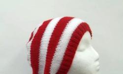 This beanie hat is hand knitted with red and white one inch stripes. Will fit women, teens and men. Medium thickness, stretches out to 31 inches around. The measurements are lying flat on a table, across the brim or ribbing = 9 inches, across the widest