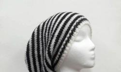 This slouch hat is knitted in black and white small stripes (1/2 inch). This hat is medium thickness, very stretchy, will fit any head, stretches out to 31 inches around. Worn by men and women. Large size. The measurements are lying flat on a table.