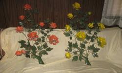 This is a pair of metal floral decorations that my mother had hanging on the wall. There's an orange one and a yellow one as you can see. They are approximately 36" high by 23" wide (at the widest point).
Nice vintage decorations. Pick up is at our