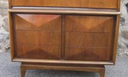 This dresser was manufactured by the United Furniture Company in the 1960s. Danish style. Solid construction with no particle board. Made of walnut. The drawers all feature .5" thick wood facades with dovetail joints. Note the design details of rounded,