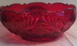 ruby red colored glass
handmade in the USA
will not lose the pretty ruby color
Detailed inverted thistle design
4" h x 8 1/2" w
No original packaging
No chips, cracks or crazing