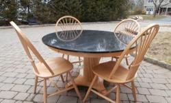 Beautiful condition, rarely used, customized Oak kitchen table, with Black Granite round top (about 4' in diameter) and 4 chairs. Purchased for $2400.00