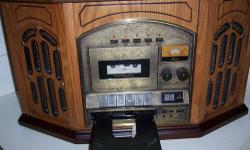 OLD TIME RADIO COMBINATION AM/FM/CD/CASSETTE/TURNTABLE ASKING 130.00 LIKE NEW PLUG IT IN IT WORKS GREAT BUT NEVER USED IT