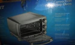 Oster Toaster Oven Extra-large interior holds 13x9" pan Whole Chicken,roast ham or frozen pizza Original $150.00 now $ 75.00 new in box