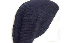This black oversized hat is made with 100% wool. This oversized beanie is solid black. Suitable for men and women and teens. It is made with a soft pure wool yarn. Completely hand knitted. Large size. Medium thickness, very stretchy, will fit any head,