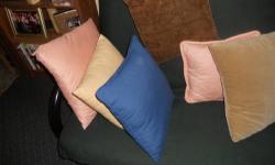 Assorted decorative designer pillows in excellent condition.