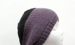 A hand knitted beanie which is purple with a black crown. The color of this beanie hat is a very soft purple called dusty purple and black . Completely hand knitted. Worn by men and women. The slouch hat is made with a soft acrylic yarn.ery stretchy, will