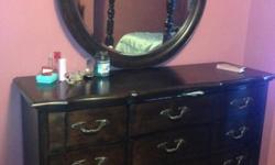 I am selling a Dresser with Beautiful mirror, it's condition is like brand new. Has no scratches and No imperfections noted to the body of the bench. Excellent Quality, Belmont cherry wood, Mirror is can be attached to Dresser, Deep Drawers so plenty of