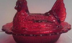 ruby red colored glass
handmade in the USA
will not lose the pretty ruby color
Detailed inverted thistle design
6" h x 7" w base
No original packaging
No chips, cracks or crazing