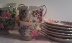 Godinger China Royal Cotswolds In The English Tradition, Pansy Pattern, Floral with gold trim.
roses and pansies with daisies in pinks, purples, blues and reds on a white background. Trimmed in gold. Cups measure 3-1/4"dia x 2-1/2"h., and hold 6oz.,
