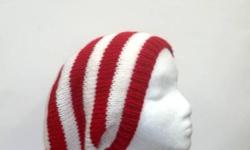 Comfortable hat. Great for the Holidays. The colors in this stripe slouch beanie are red and white one inch stripes. Large size. It is made with a soft acrylic yarn. Stretches out to 31 inches around. The measurements are lying flat on a table, across the