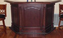 Solid Cherry wood home bar with footrest - 9 bottles wine rack and cabinets - Dimension 75"Wx26"Dx42'H.
Must be pick up