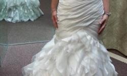 Gently worn Sottero & Midgley "Sloan" wedding gown. Original size 12, but altered to approximately a street size 8. Dressed retailed for $1800 and had $450 in alterations done including inverted bustle to show off beautiful ruffles, sash sewn directly