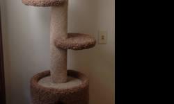 All *reasonable* offers considered.
This is a used cat tree, 5' 6" tall, covered with carpeting, and sisal on the uprights. There's an area of leg (the right one in the picture) where most of the sisal has been shredded off, and there's bits of damage
