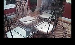 Glass top table with 4 chairs. great condition. $250 OBO
contact debbie 845-597-8487