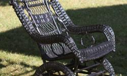 Late nineteenth century Victorian wicker platform rocking chair--painted black. Very good condition. No cushion.