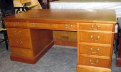 This is a 1970-1980s Partner's Desk made from Cherry Wood. It is in relatively very good to excellent condition. Two or three small spots on the top were professionally repaired in the past. Possible wear or damage spots that were previously repaired with