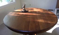 The base has been replaced, the round oak top is authentic. This lovely round oak table has been appraised in 1987 for a great deal more; the family needs to empty the house in order to put it on the market.