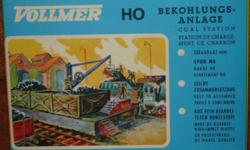 USA SHIPS FREE!
For sale are two (2) HO Scale TRACKSIDE ACCESSORIES from Vollmer.
You will receive:
* 1 - Kit #5719 B - Coal Station (Bunker)
Dimensions: 5-5/8 x 2-1/2" (13 x 6 x 6.5cm)
* 1 - Kit #5705 - Loading Gauge and Water Spout/Column
Column: 2-1/2