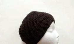 A very comfortable and warm skullcap beanie. Worn by men and women. The color of this skullcap beanie hat is dark brown. It is made with a soft acrylic yarn. Very stretchy, will fit any head, stretches out to 28 inches around. The measurements are lying