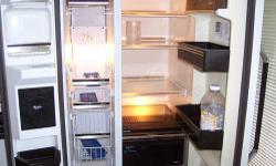 WHIRLPOOL DOUBLE DOOR REFRIGERATOR WITH COLD WATER AND ICE CUBE MAKER IN DOOR $ 375.00 NEG MUST PICK UP IN FLUSHING QUEENS