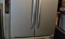 Large 25 cubic foot Refrigerator. Originally paid $1,600 for. Works great and has plenty of storage. 70&1/2 inches High; 35&3/4 inches wide; 32 inches deep not including 2&1/4 inch protruding handles. Ice maker is inside bottom pullout freezer section.