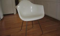 This is a classic fiberglass shell chair with arms and metal base. Excellent, clean condition and very sturdy. Purchased from Modernica, a company that owns the original molds of this style chair, just a few years ago. Excellent condition and very sturdy.