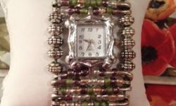 Purple Beads on Safety Pins with a silver watch face.