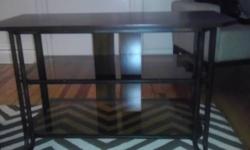 wood table with glass top in very good shape
36'' long 16'' high 21''wide with detailed flower arrangment in wood
you provide means to move table