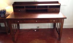 Beautiful Raymour and Flanigan Wooden Desk. Two pieces, upper hutch detachable. Three drawers on main body, two on hutch with four compartments and shelf.
Accepting all offers. Receipt Attached. Will help with move, need to get it off my hands ASAP