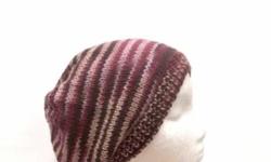 A very cute beanie. This handmade knit wool beanie hat is made with a soft pure variegated wool yarn of light and dark pink, dark brown and tan colors. This beanie is a medium thickness (not heavy) very stretchy. The measurements are lying flat on a